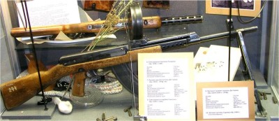 

 Kalashnikov Weapons Museum. Submachine gun by Degtyarev, with bipod.
Above it: Assault rifle by Sudayev, 1944 (prototype).
 