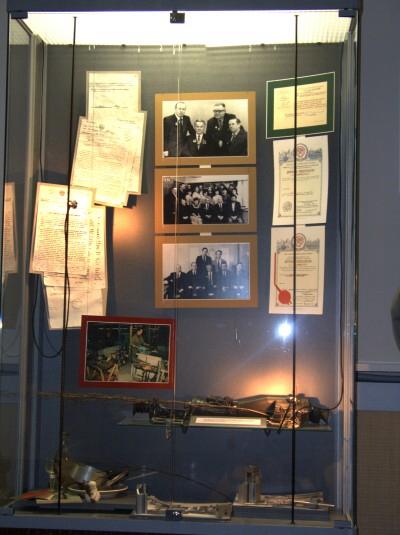 

Museum of Kalashnikov. showcase features photos of Mikhail Kalashnikov with colleagues

